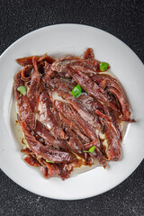 anchovies in a plate on the table canned fish in oil fresh and tasty seafood meal food snack on the table copy space food background rustic