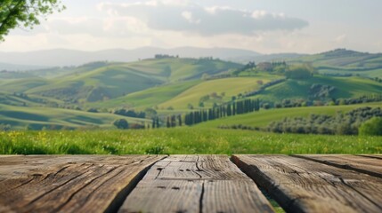 Wooden table with picturesque green hills background. Ideal for nature concepts. Serene rustic outdoor scenery. Perfect for travel promotions or landscape displays. 