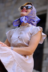 Beautiful woman with blue eyes dressed in the 1920s in the Barcelona cathedral