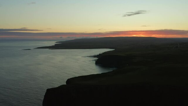Astonishing aerial views of County Clare and the calm Atlantic Ocean at sunrise. Cliffs of Moher