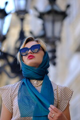 Beautiful woman with blue eyes dressed in the 1920s in the Barcelona cathedral