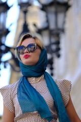 Beautiful woman with blue eyes dressed in the 1920s in the Barcelona cathedral