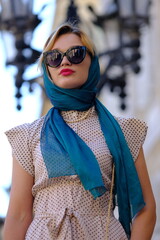 Beautiful woman with blue eyes dressed in the 1920s in the Barcelona cathedral