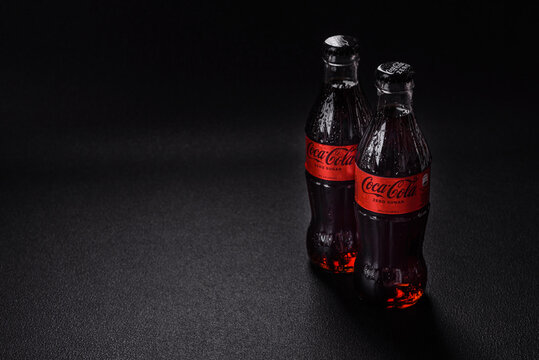 Nikopol, Dnepropetrovsk region/Ukraine - July 15 2024: A bottle of chilled coca-cola zero with drops of water on a black background