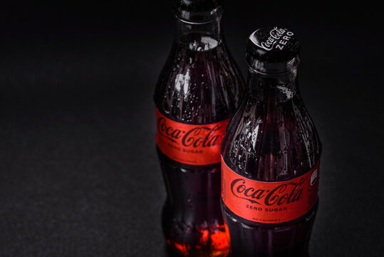 Nikopol, Dnepropetrovsk region/Ukraine - July 15 2024: A bottle of chilled coca-cola zero with drops of water on a black background