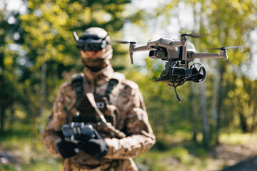 Fototapeta premium Military operator control FPV UAV drone with device for releasing bombs and grenades to enemy positions