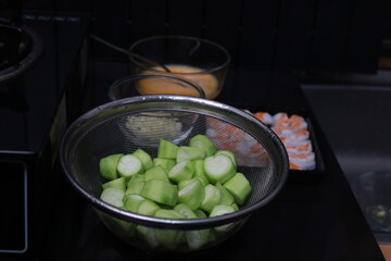 the raw material preparation to cook Stir-fried vegetables
Zucchini with eggs and shrimp near the gas stove