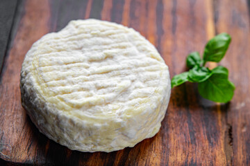 soft cheese cow milk, goat or sheep cheese natural fresh appetizer meal food snack on the table copy space food background rustic top view