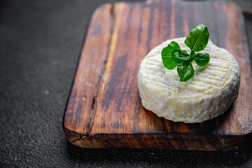 soft cheese cow milk, goat or sheep cheese natural fresh appetizer meal food snack on the table copy space food background rustic top view