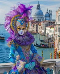 Gordijnen Photo of Venice Carnival in Italy, woman wears colorful costumes and mask with feathers on their heads against the backdrop of canals and palaces. The background is picture of venice city © Irena