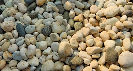 Different sizes of stones and pebbles on the beach, pebble photography 