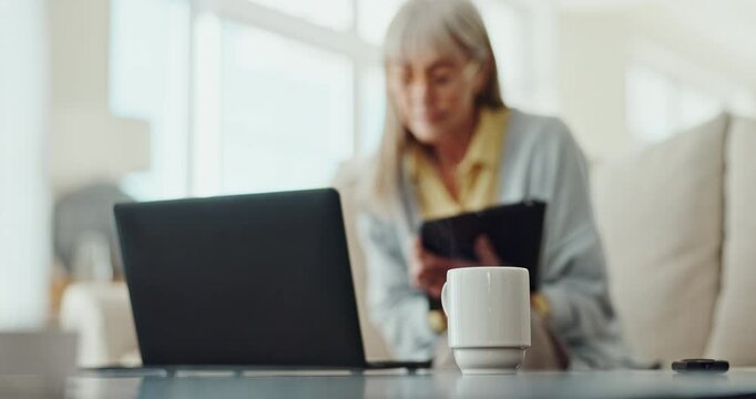 Mature woman, relax and technology with coffee cup for comfort, internet or home streaming services. Person with tea or warm beverage for planning on laptop, phone or digital tablet while watching tv