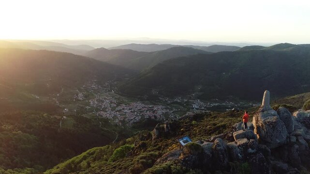 Aerial view of Frag&atilde;o do Corvo Viewpoint, Serra da Estrela Nature Park, with the village of Penhas Douradas in the background -  municipality of Manteigas, Guarda District, Portugal
