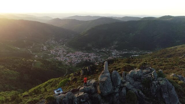 Aerial view of Frag&atilde;o do Corvo Viewpoint, Serra da Estrela Nature Park, with the village of Penhas Douradas in the background -  municipality of Manteigas, Guarda District, Portugal