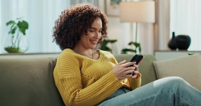 Woman, phone and planning vacation online in home, scroll and research for holiday in living room. Female person, relax and website for booking travel on couch, communication and app for social media