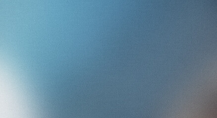 Abstract effect created by grainy texture on blurred blue gradient background