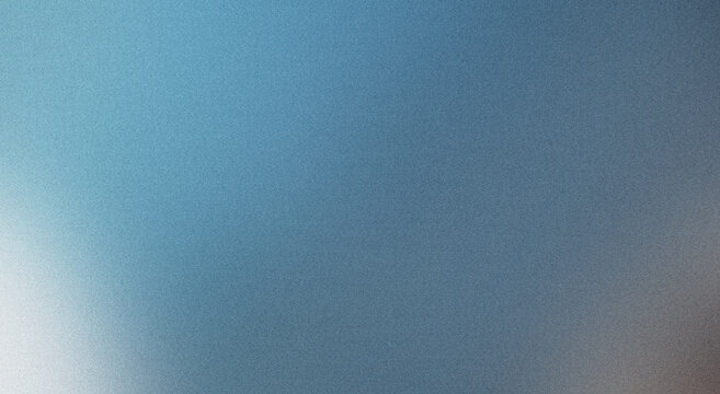 Abstract effect created by grainy texture on blurred blue gradient background