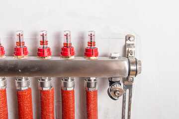 Water underfloor heating. Distributor of central underfloor heating system. Flow meters and air...