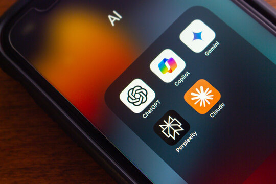 Vancouver, CANADA - Jul 15 2024 : ChatGPT, Microsoft Copilot, Google Gemini, Perplexity and Claude icons seen on an iPhone. Leading Artificial Intelligence, Generative AI Chatbot Concept