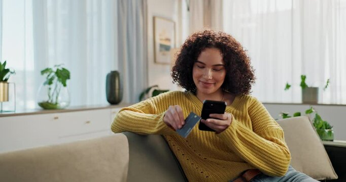 Woman, phone and credit card on couch for payment in living room for ecommerce with fintech app for deal. Person, online shopping and smartphone with sale from targeted advertising on social media