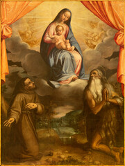 SPELLO, ITALY - MAY 18, 2024: The painting of Madonna with the St. Francis of Assisi and St....
