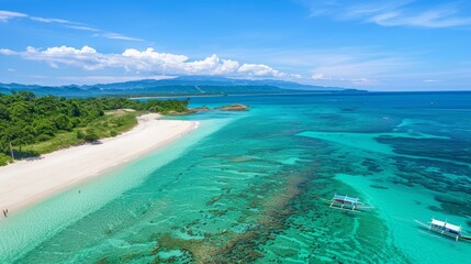 Fototapeta premium Experience the pristine beauty of Saud Beach in Pagudpud, Philippines. This captivating photo showcases its powdery white sand and crystal-clear turquoise waters. 