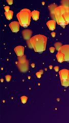 Sky lanterns floating in the night sky.