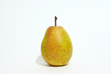 A Pear on a White Surface With a White Background