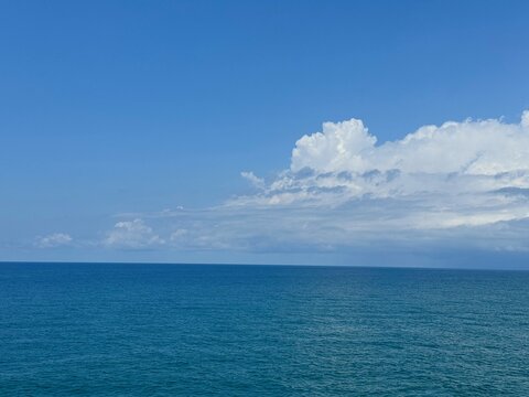 Amazing clouds in the sky above blue sea