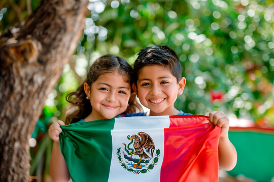 young mexican childs holding a Mexico flag