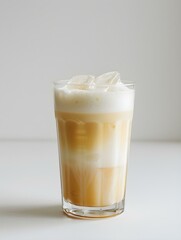 Beige Summer Drink on a light Background with Sunlight and Shadows