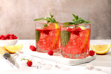 Lemonade cocktail,mojito with tequila, gin, rum, vodka, liqueur, lime, ice and fresh raspberries,...