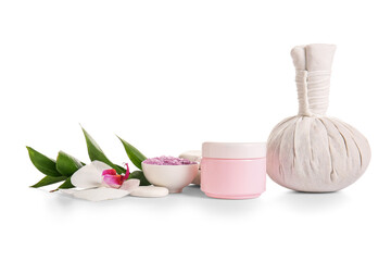 Spa composition with massage herbal bag, cream and sea salt on white background