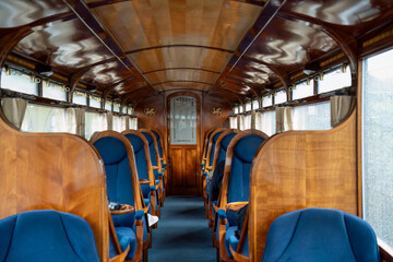 beautiful interior of a steam train passenger carriage, a vintage working steam locomotive train of the Ffestiniog Railway, Porthmadog, Wales