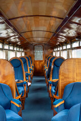 Fototapeta premium beautiful interior of a steam train passenger carriage, a vintage working steam locomotive train of the Ffestiniog Railway, Porthmadog, Wales