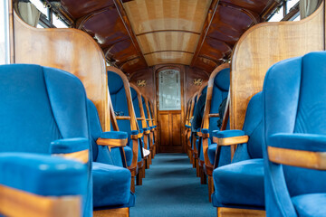beautiful interior of a steam train passenger carriage, a vintage working steam locomotive train of the Ffestiniog Railway, Porthmadog, Wales