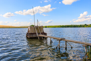 Fototapeta premium Inscription in Russian Swimming is prohibited on concrete technical dam of a pond or lake