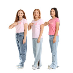 Obraz premium Beautiful women pointing at awareness pink ribbons on white background. Breast cancer concept