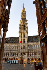 Beautiful view of the Town hall in Brussels, Hôtel de ville de Bruxelles. Golden light, blue sky. Vertical photo