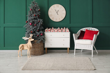 Interior of living room with Christmas tree and advent calendar on commode