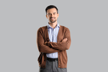 Handsome businessman on light background