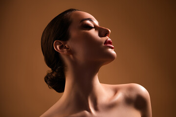 Photo of stunning dreamy girl enjoying ideal smooth skin after beauty procedure isolated on beige color background