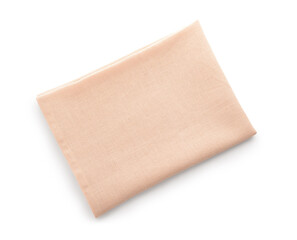 Fabric beige napkin on white background. Top view