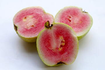 Fresh pink guava on white background.