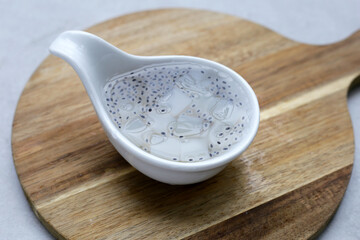 Coconut jelly with basil seeds in syrup