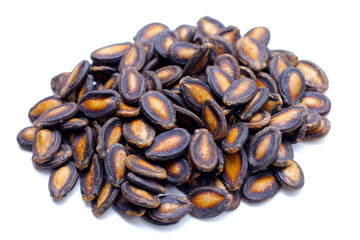 Roasted watermelon seeds on white background.