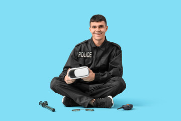 Male police officer with VR glasses sitting on blue background