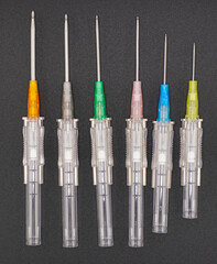 This is a group of intravenous catheters, laid into different patterns, creating a colorful background. This shows the health and medicine concept.