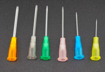 This is a group of intravenous catheters, laid into different patterns, creating a colorful background. This shows the health and medicine concept.