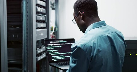 Laptop, data engineer and black man coding on software for cybersecurity in business with server room. Professional, employee and African male person programming on database with technology online